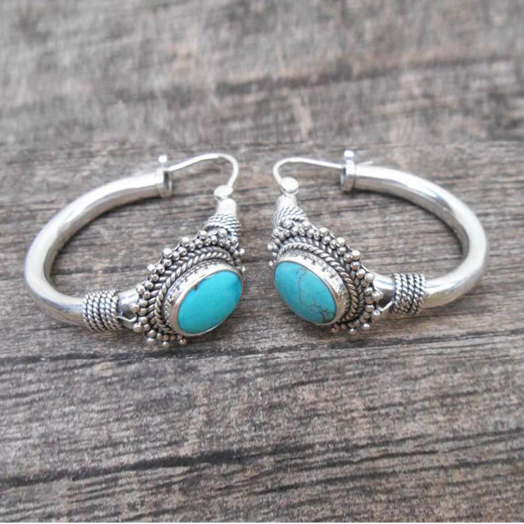 Eleganta örhängen i sterlingsilver med turkosmotiv
