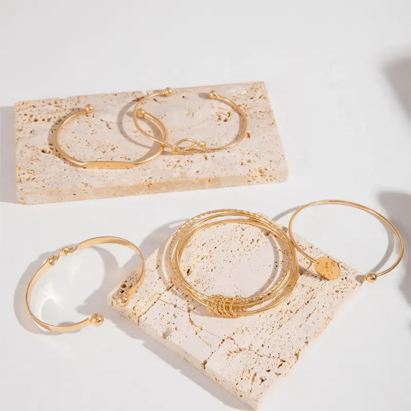 Elegant set med guldarmband