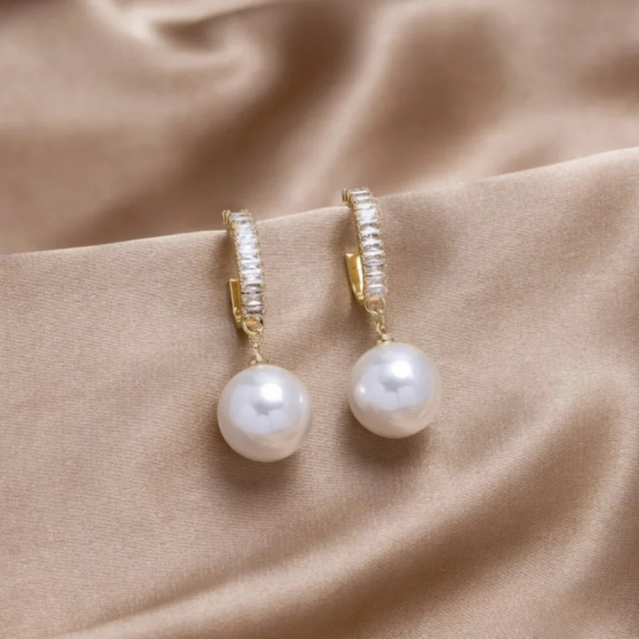 Eleganta örhängen med pärla och zirkonia