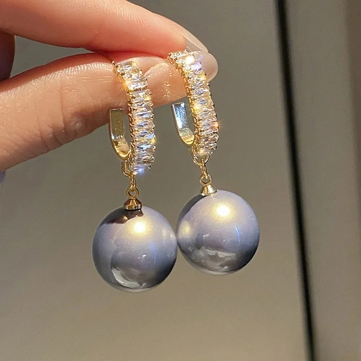 Eleganta örhängen med pärla och zirkonia