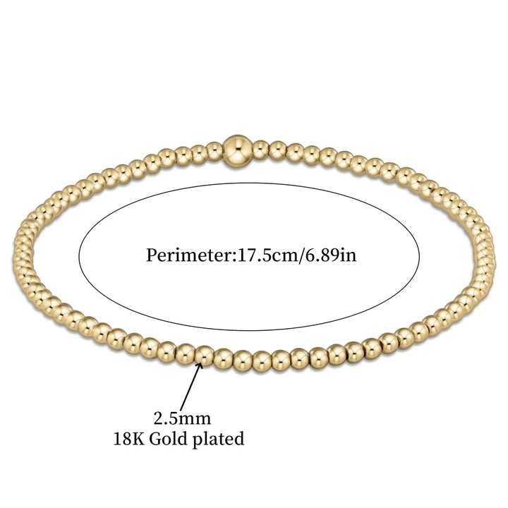 Elegant armband i 18 karat guld med turkosa pärlor