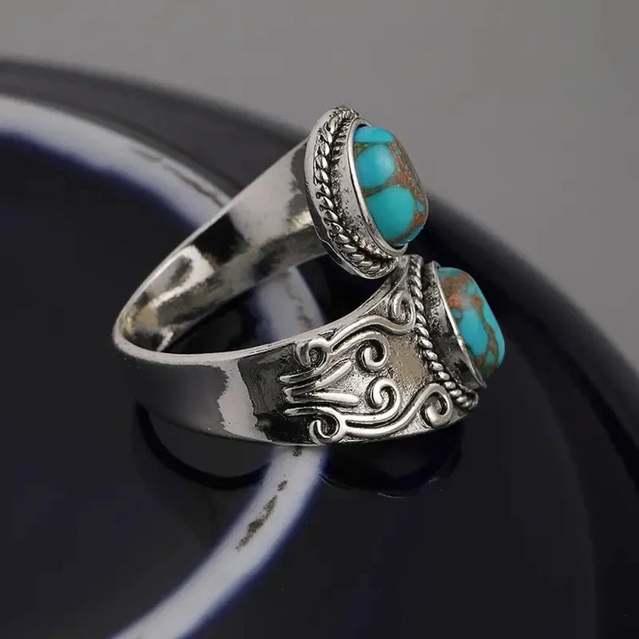 Elegant vintage turkos korsbandsring
