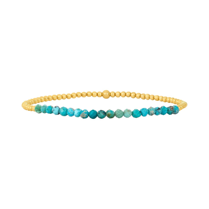 Elegant armband i 18 karat guld med turkosa pärlor