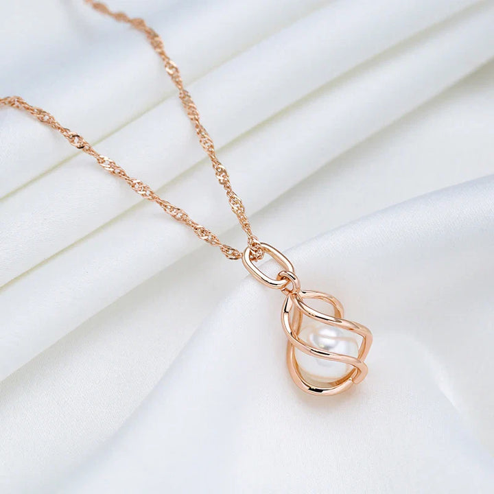 Exklusivt geometriskt pärlhalsband i roséguld