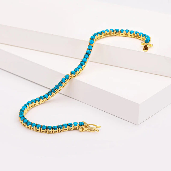 Elegant guldfärgad turkos kedjearmband