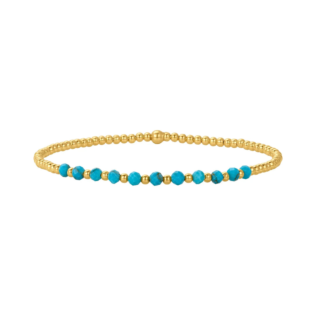 Elegant armband i 18 karat guld med turkosa pärlor