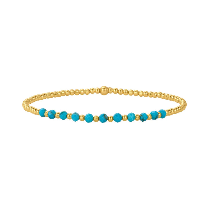 Elegant armband i 18 karat guld med turkosa pärlor