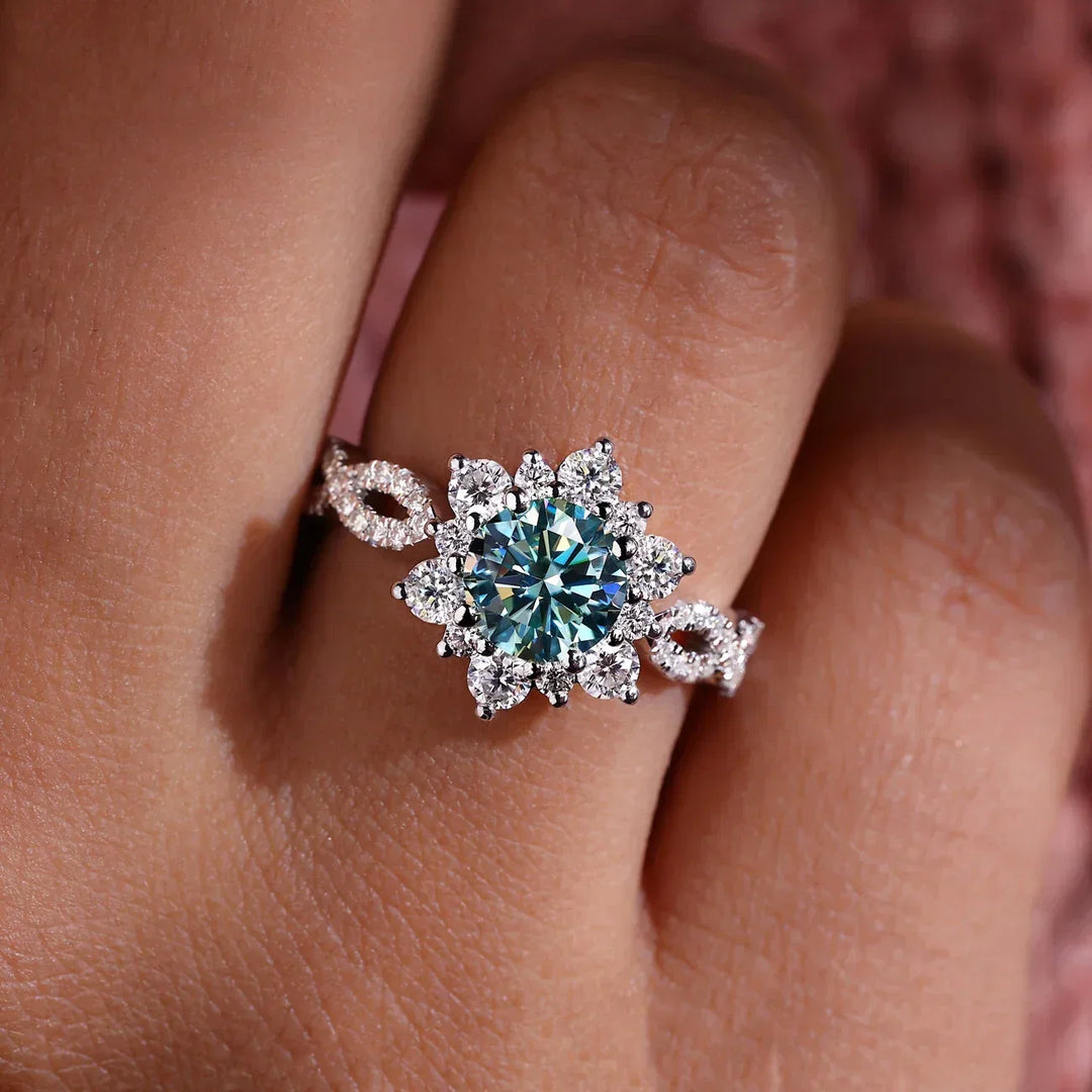 Elegant vitguldring med turkosblomma