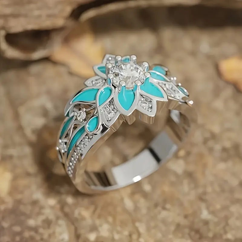 Elegant ring med turkosa blommor och kristaller